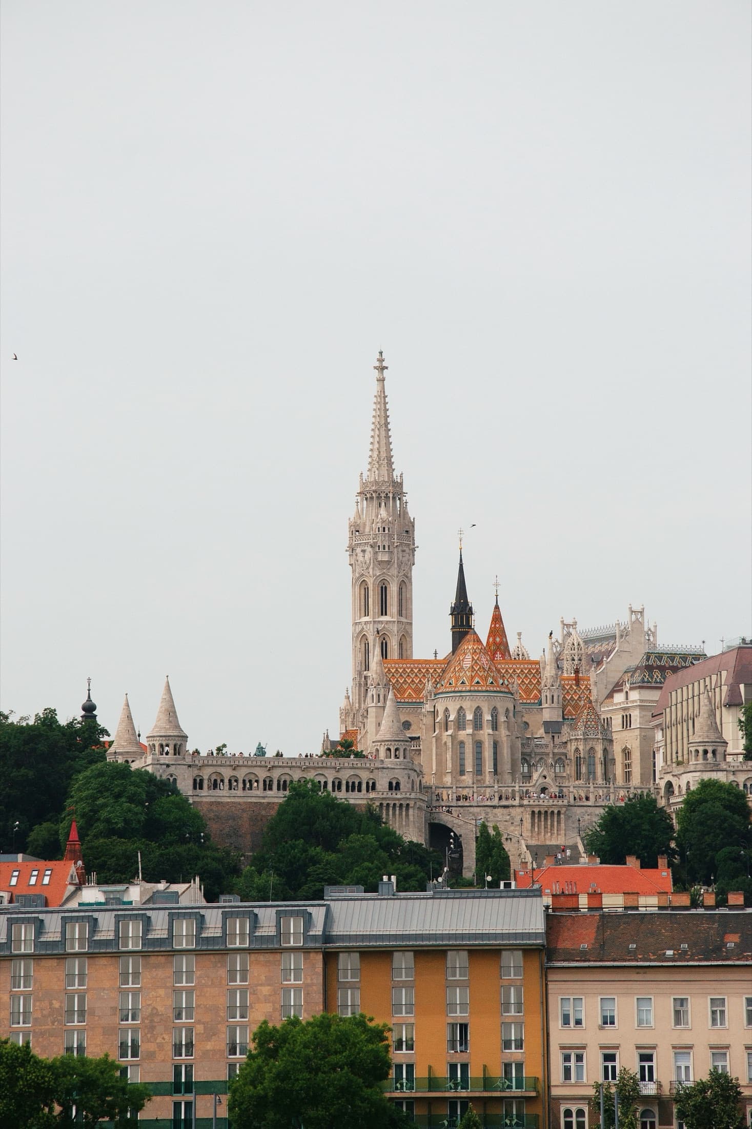 The Matthias Church tower in Budapest under clear skies
