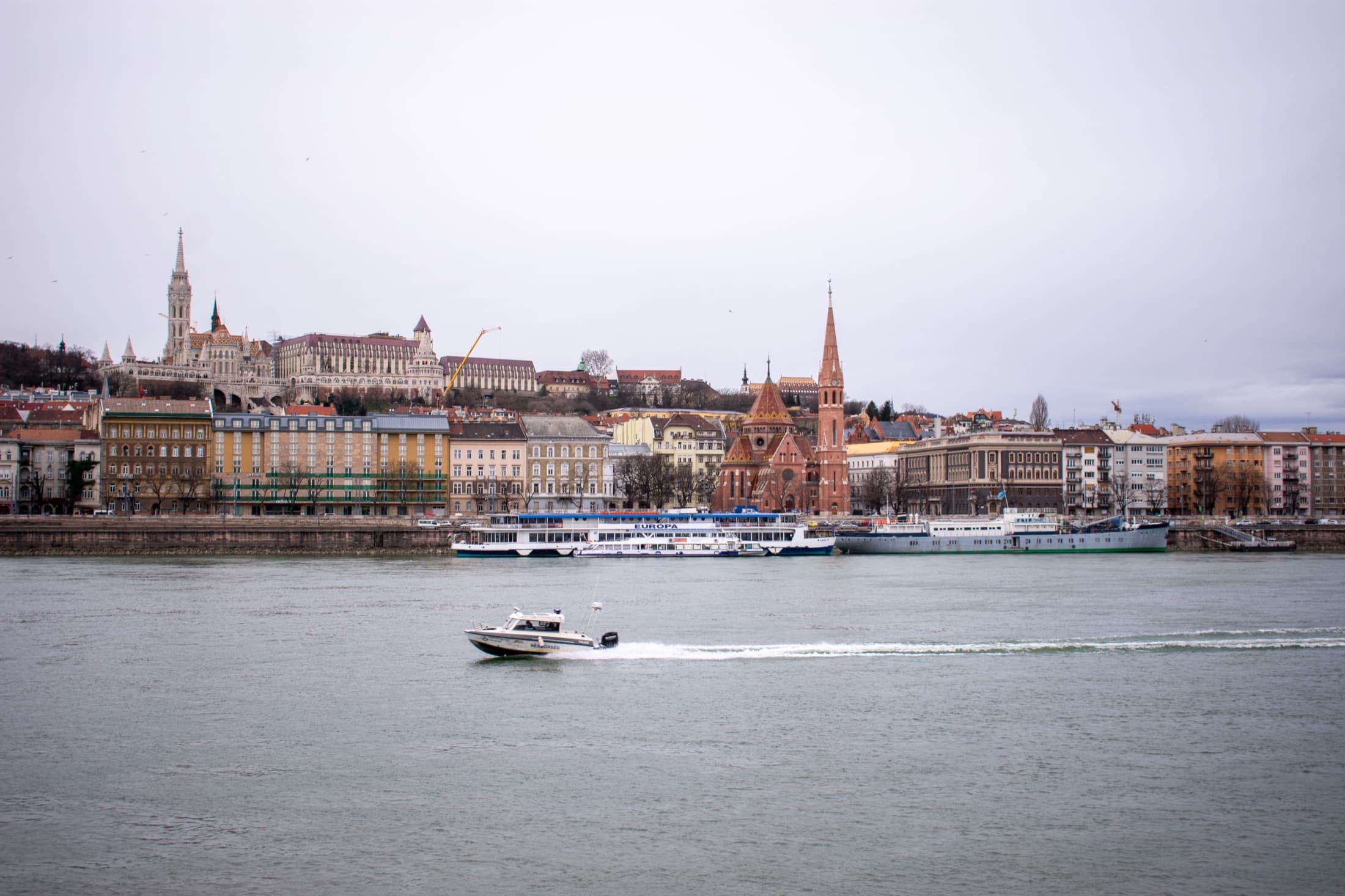 Budapest's cityscape and landmarks along the Danube River by day