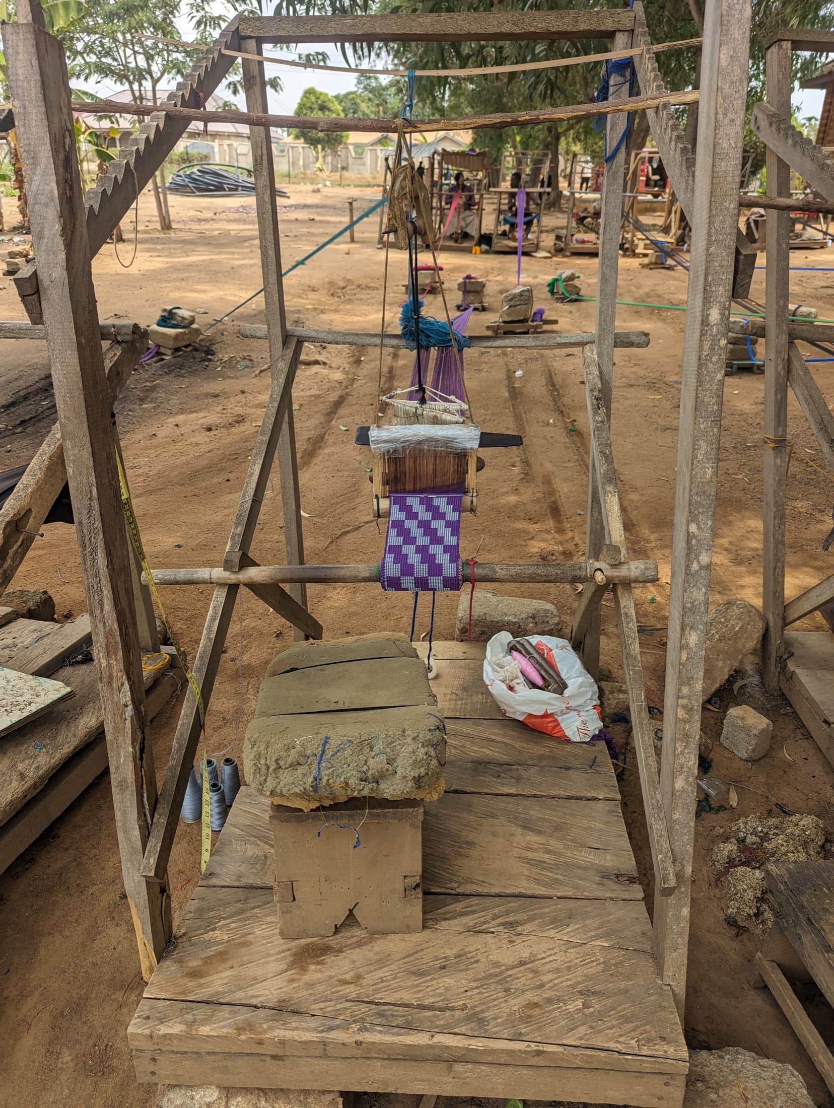 A traditional wooden kente loom used by weavers near Kumasi