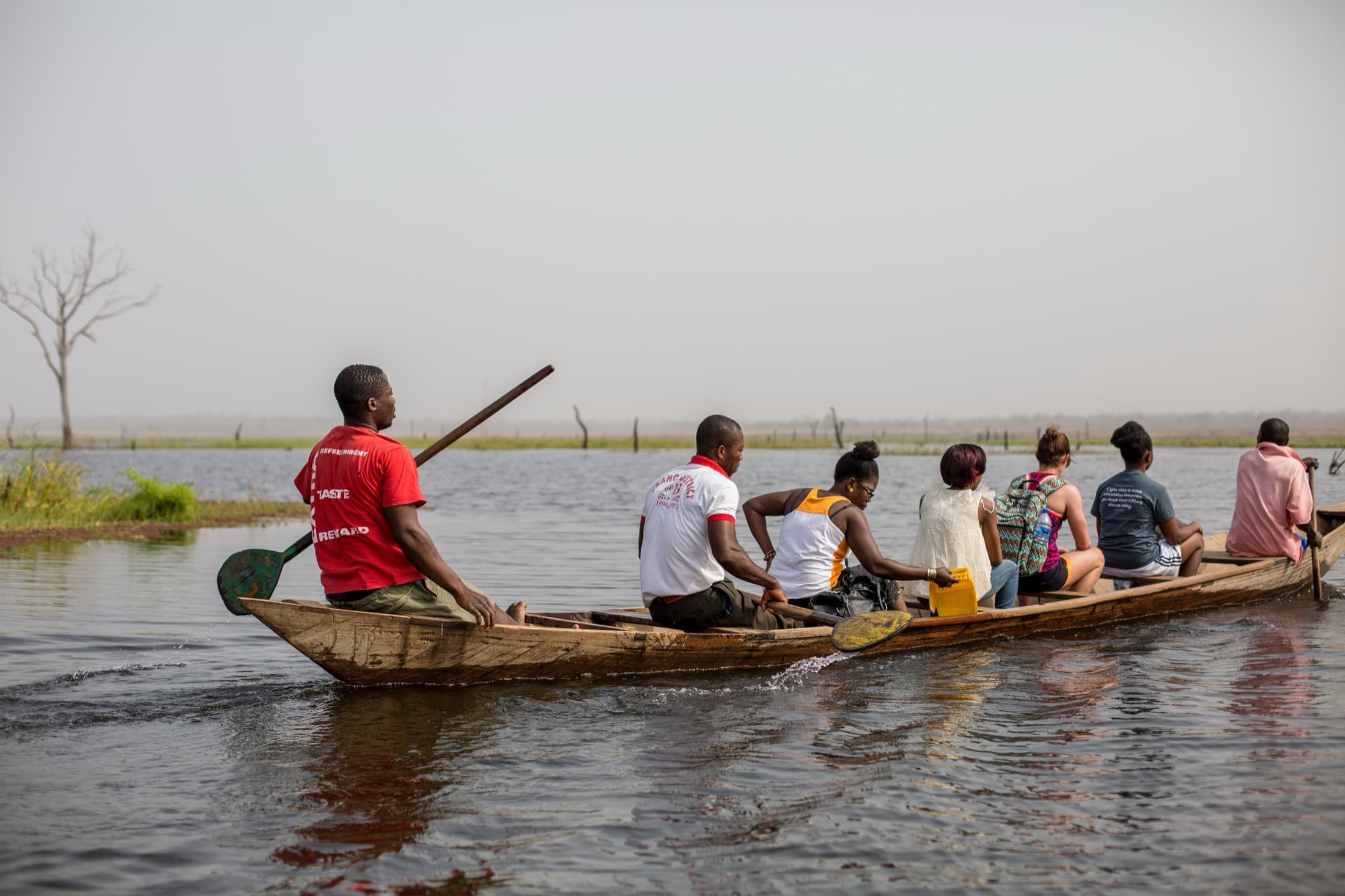 A wooden canoe ferrying passengers across Lake Volta, the world's largest reservoir by surface area