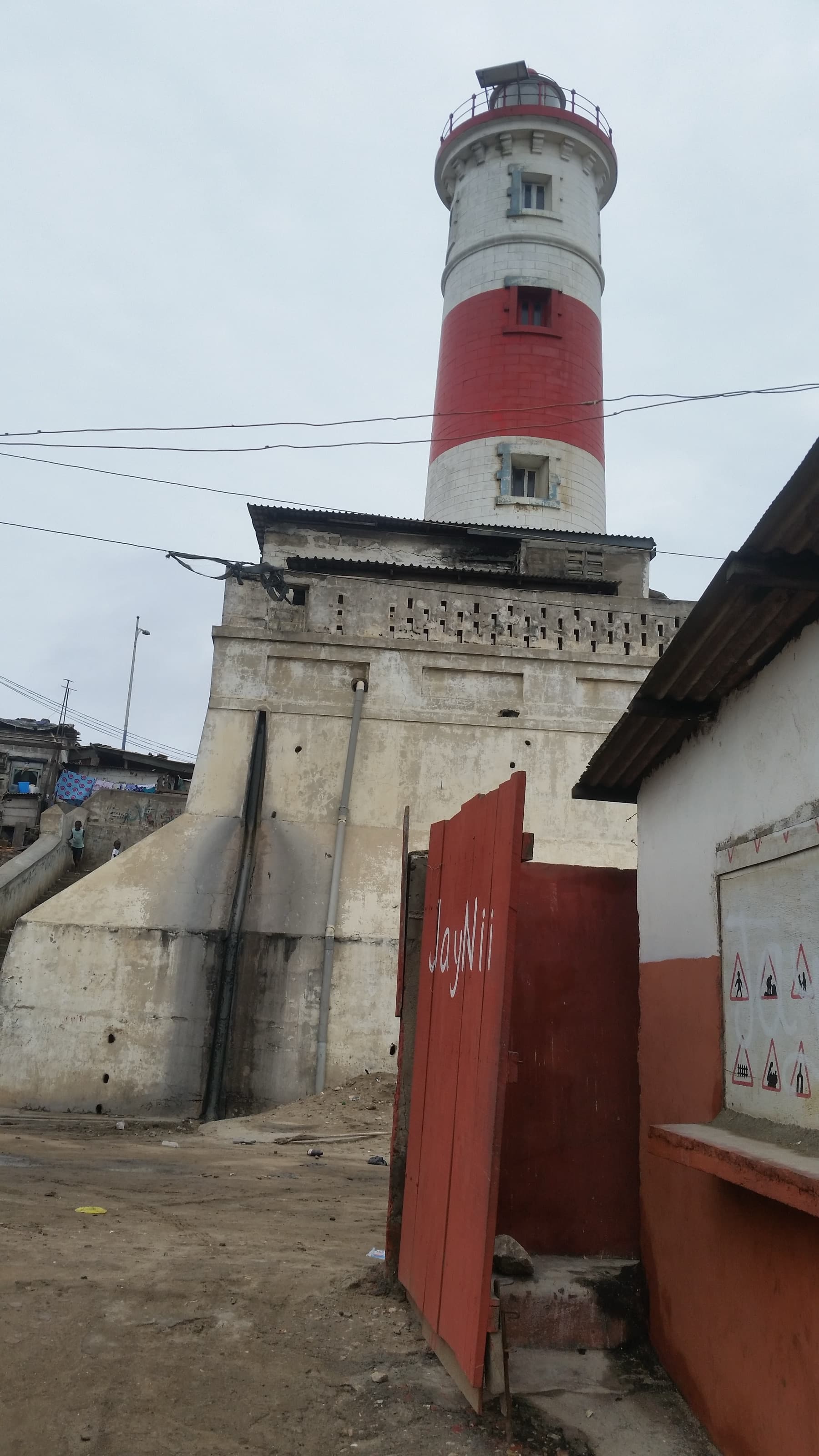 The red-and-white striped Jamestown Lighthouse overlooking the historic Jamestown district of Accra