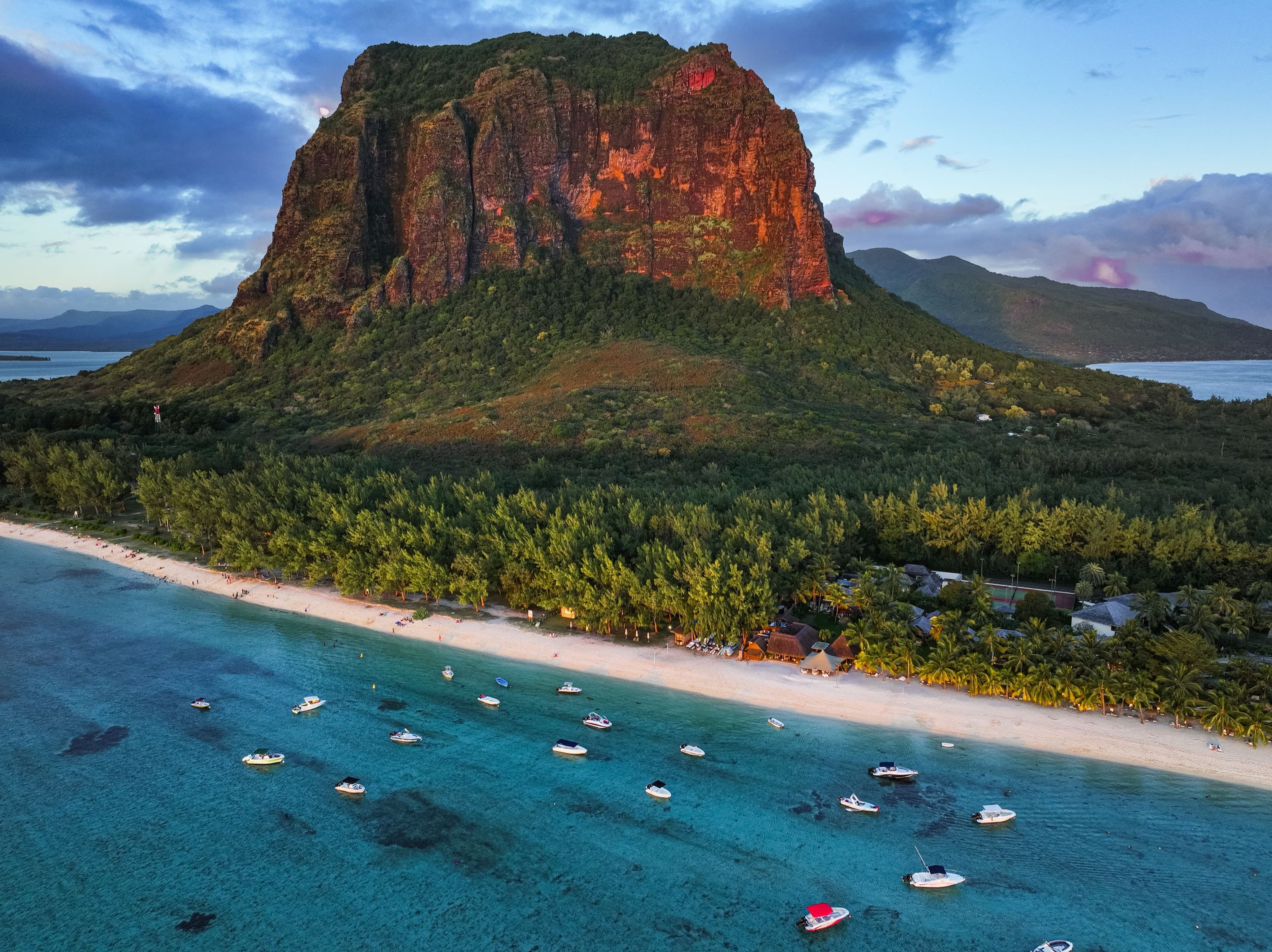 Aerial view of Le Morne Brabant mountain with surrounding beach and boats, Mauritius