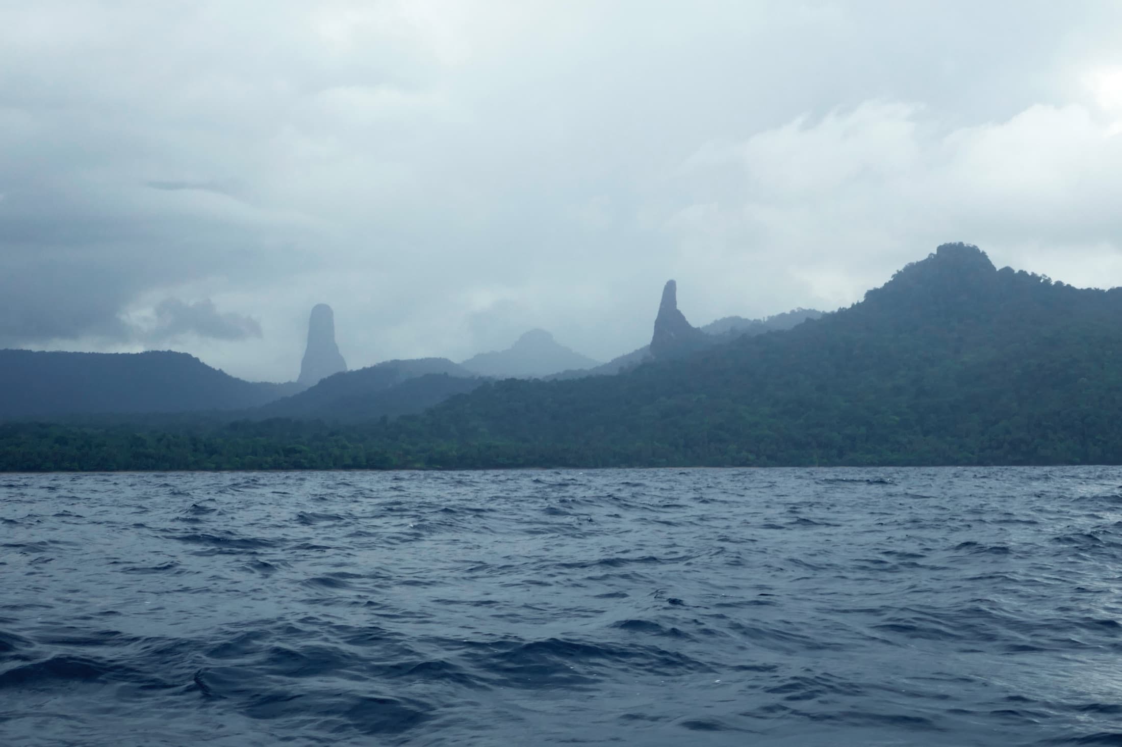 Pico Cão Grande and the smaller Cão Pequeno rock spire, seen from a boat off São Tomé's west coast