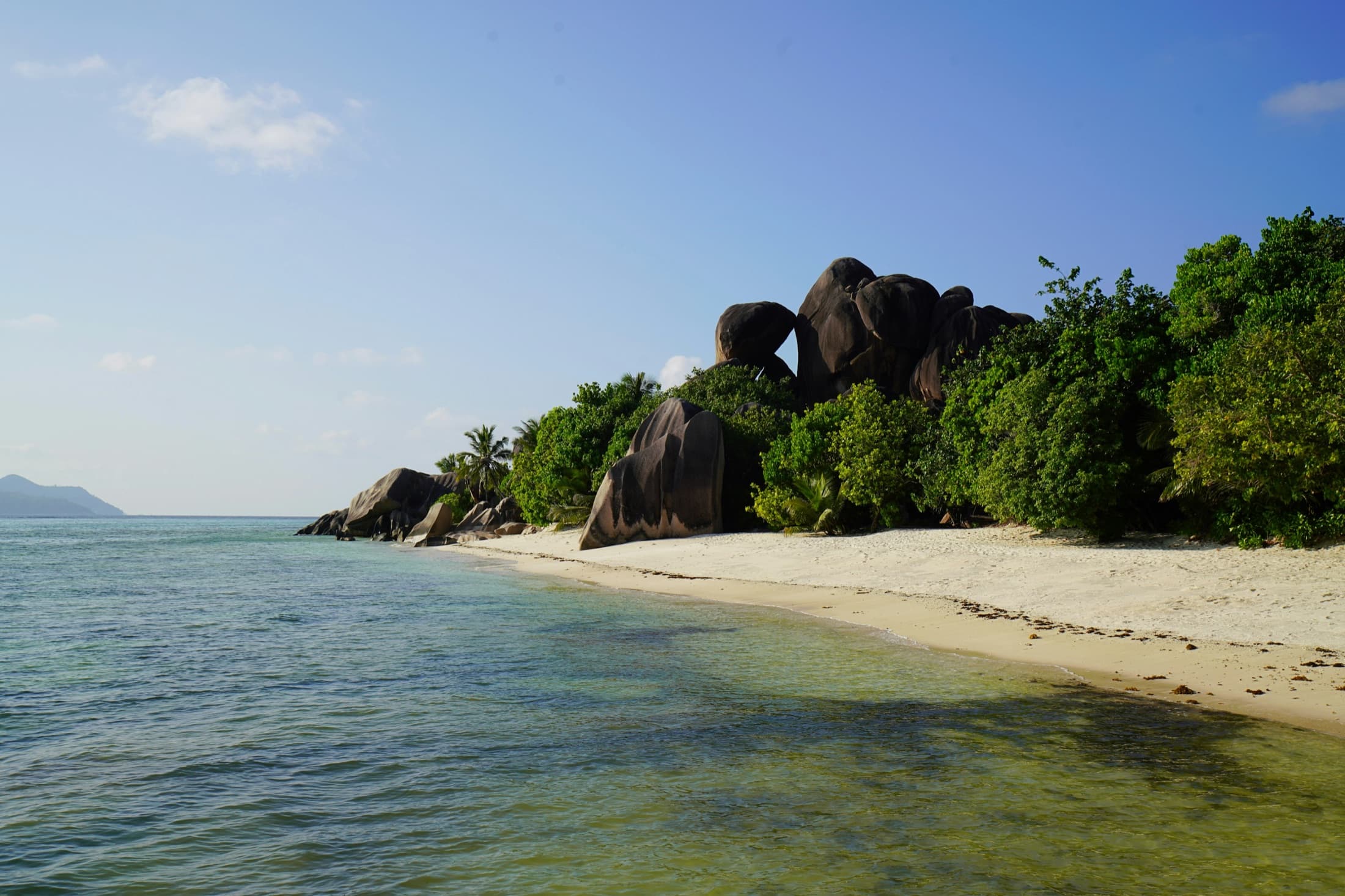 Granite boulders lining the shoreline at Anse Source d'Argent, La Digue, Seychelles