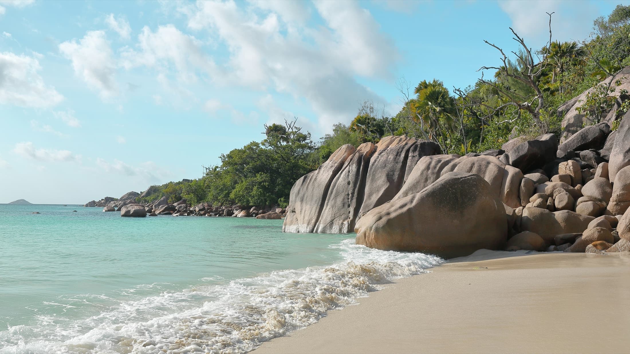 Granite boulders on the shore at Anse Lazio beach, Praslin, Seychelles