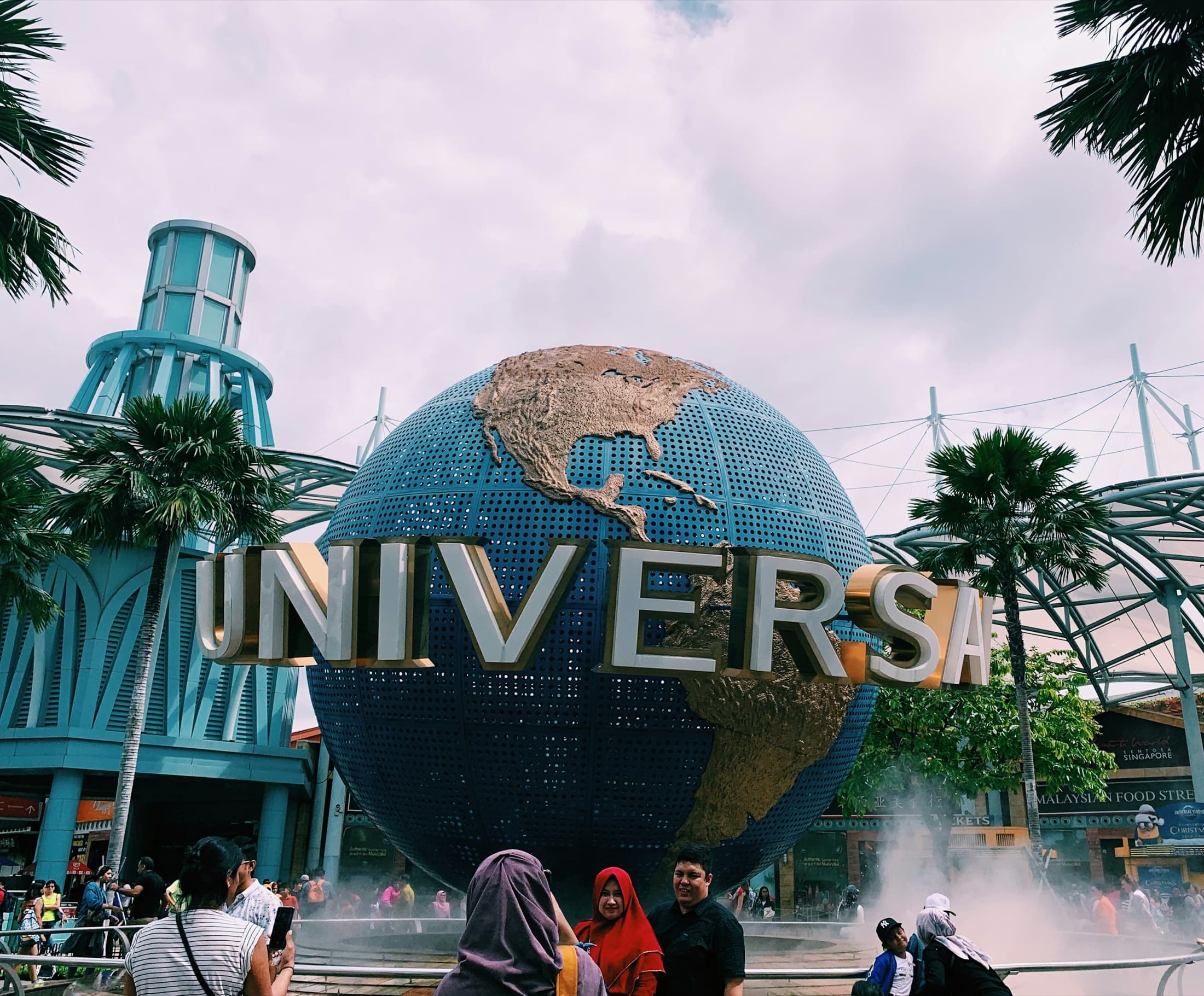 Visitors photographing the iconic globe at Universal Studios Singapore