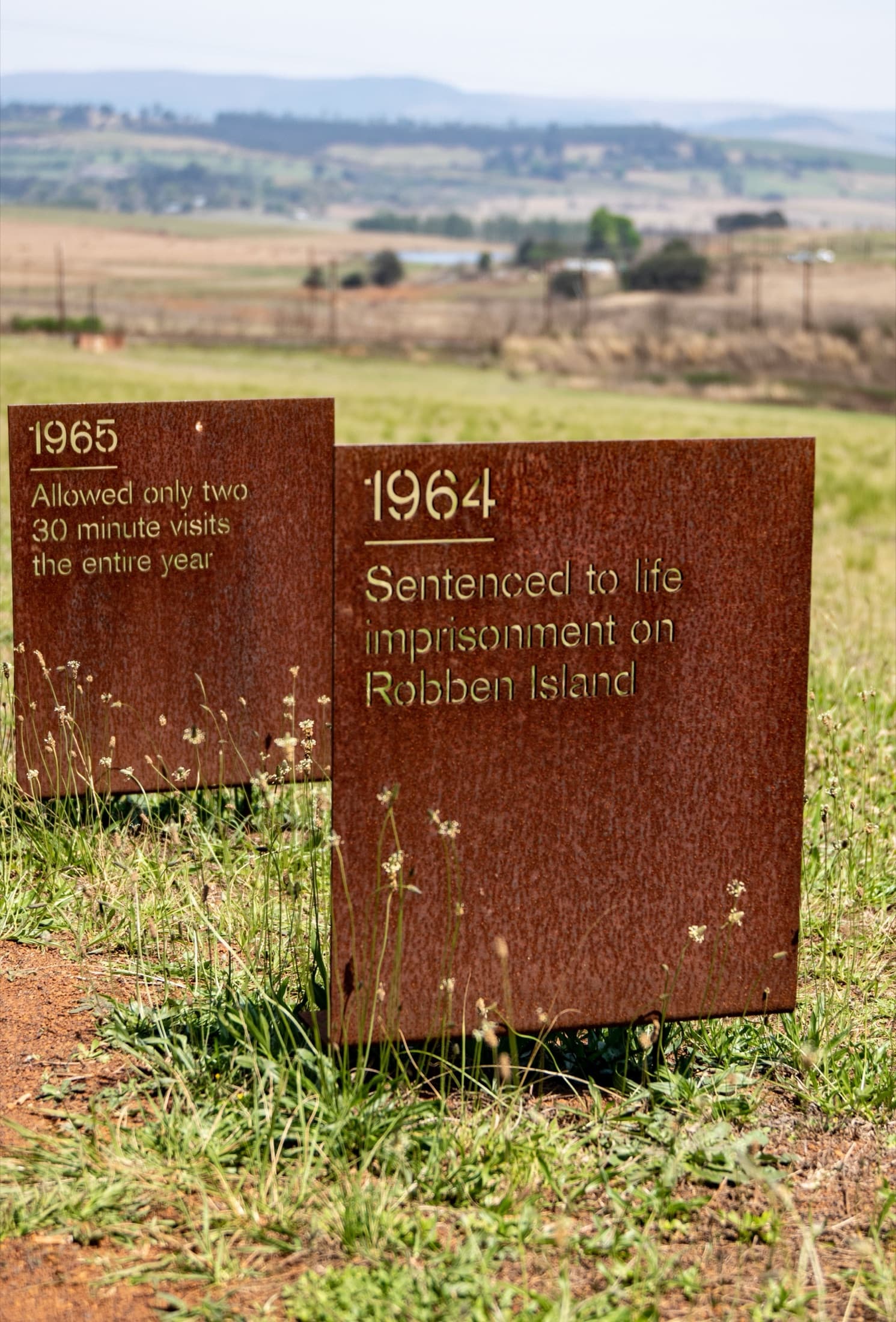 Memorial plaques at Robben Island commemorating significant historic events