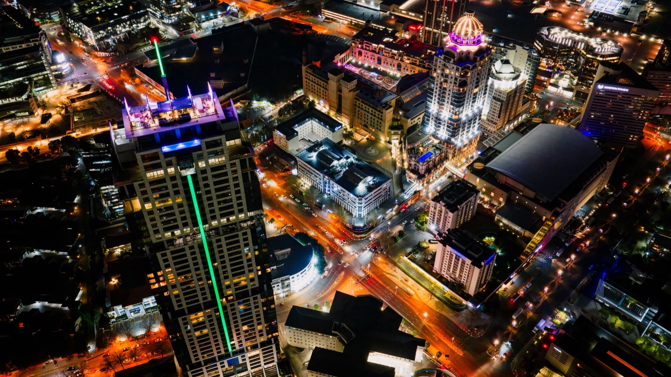 Aerial night view of the illuminated Sandton skyline in Johannesburg, South Africa