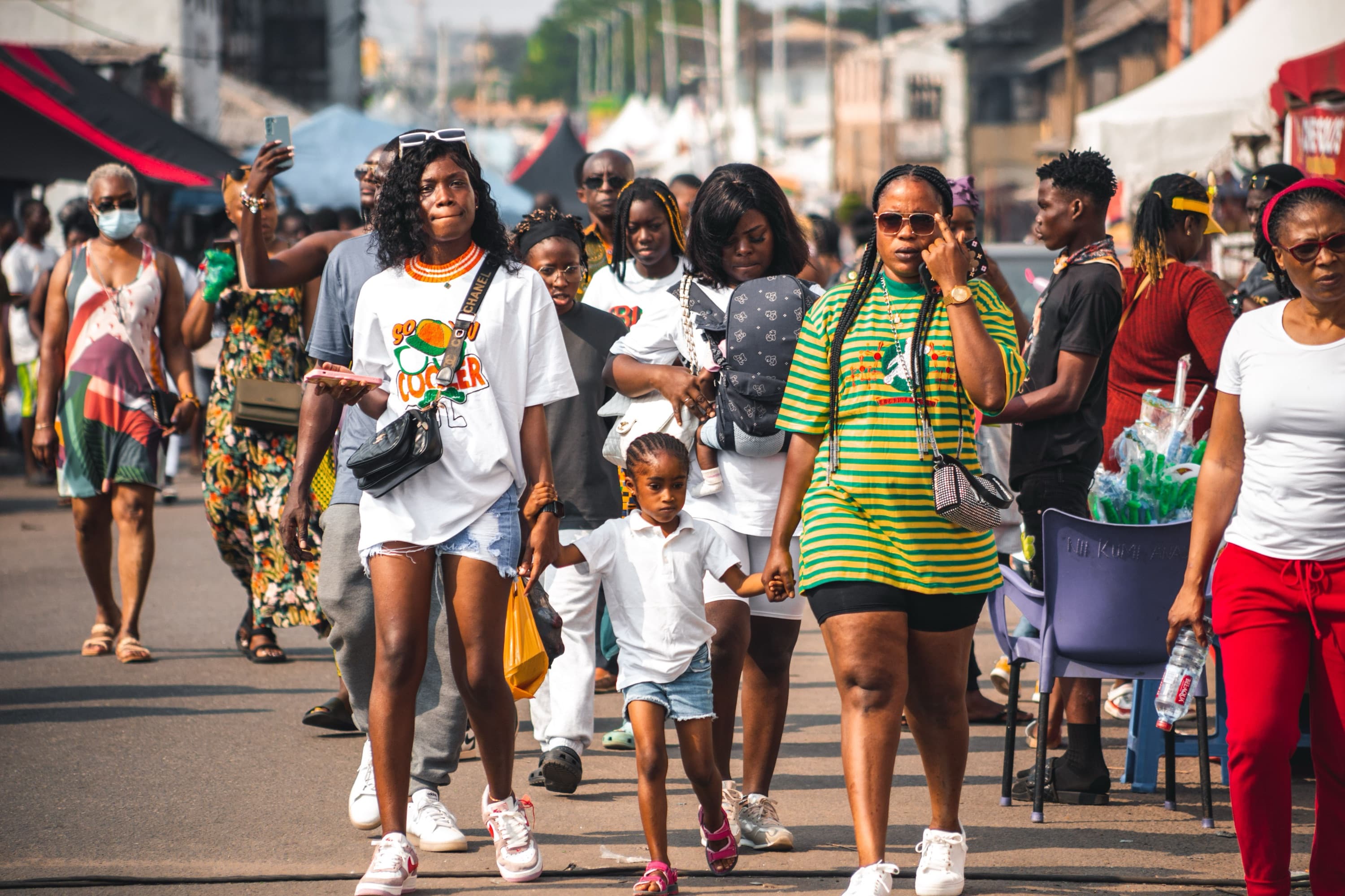 People walking on a bustling street in Accra, Ghana