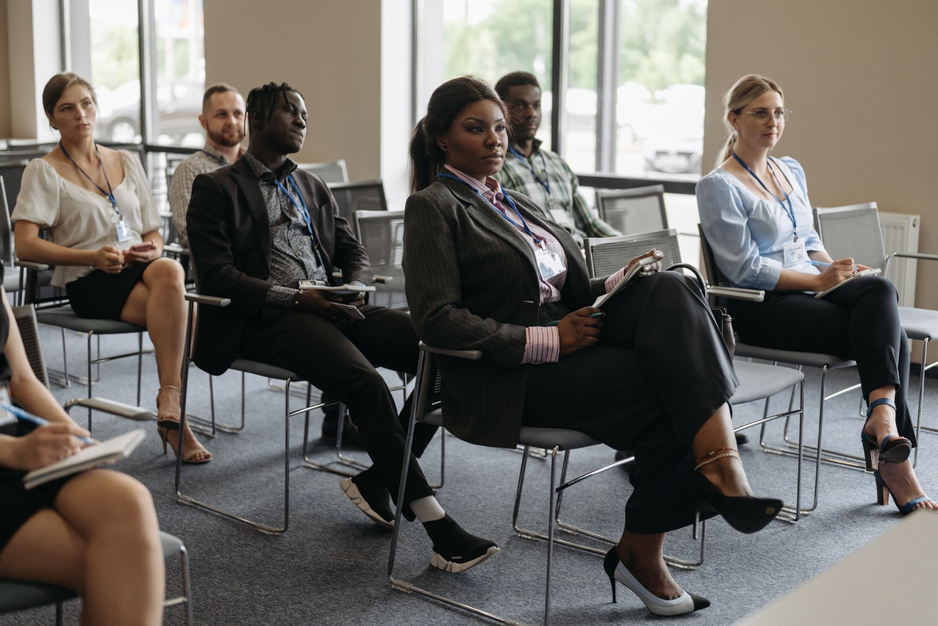 Attendees seated at a business conference